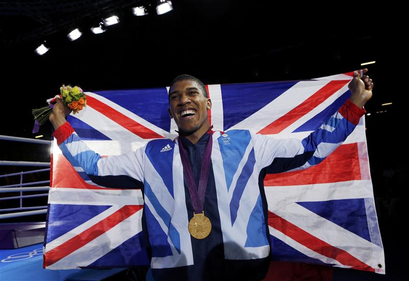 CHAMPION: Anthony Joshua took gold against Italy's Robert Cammarelle with a storming third round performance